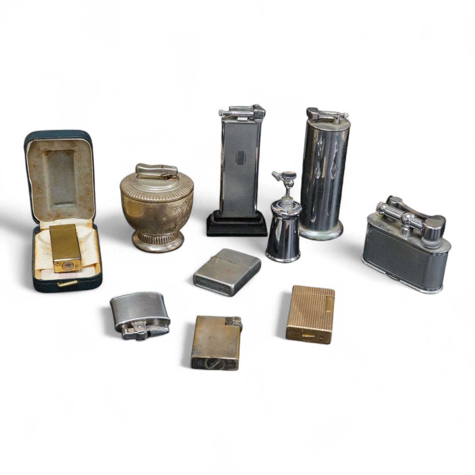 Ten assorted lighters including two Dunhill examples, a Ronson and Dupont, largest 12cm high